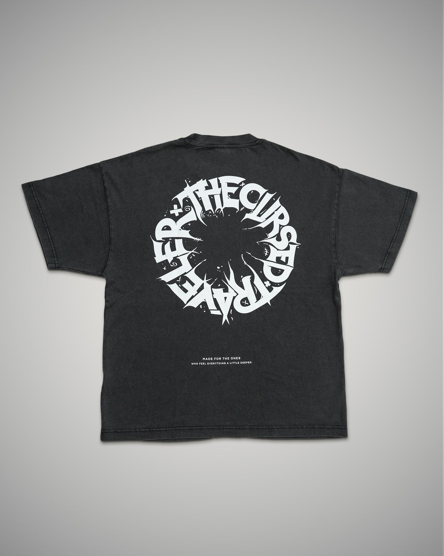 Black t-shirt with white graphic design on a gray background