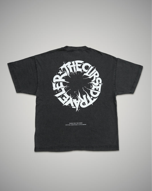 Black t-shirt with white graphic design on a gray background